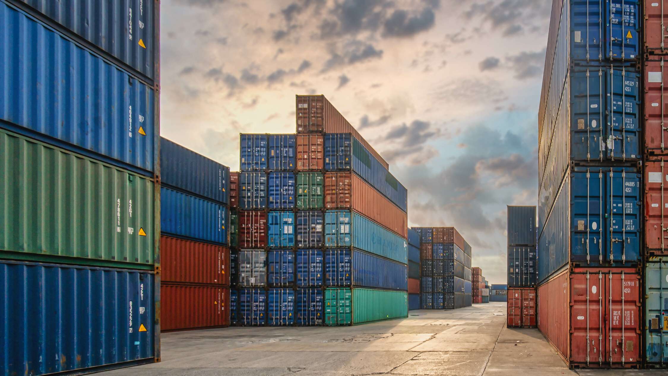 perspective view of containers at containers yard with forklift